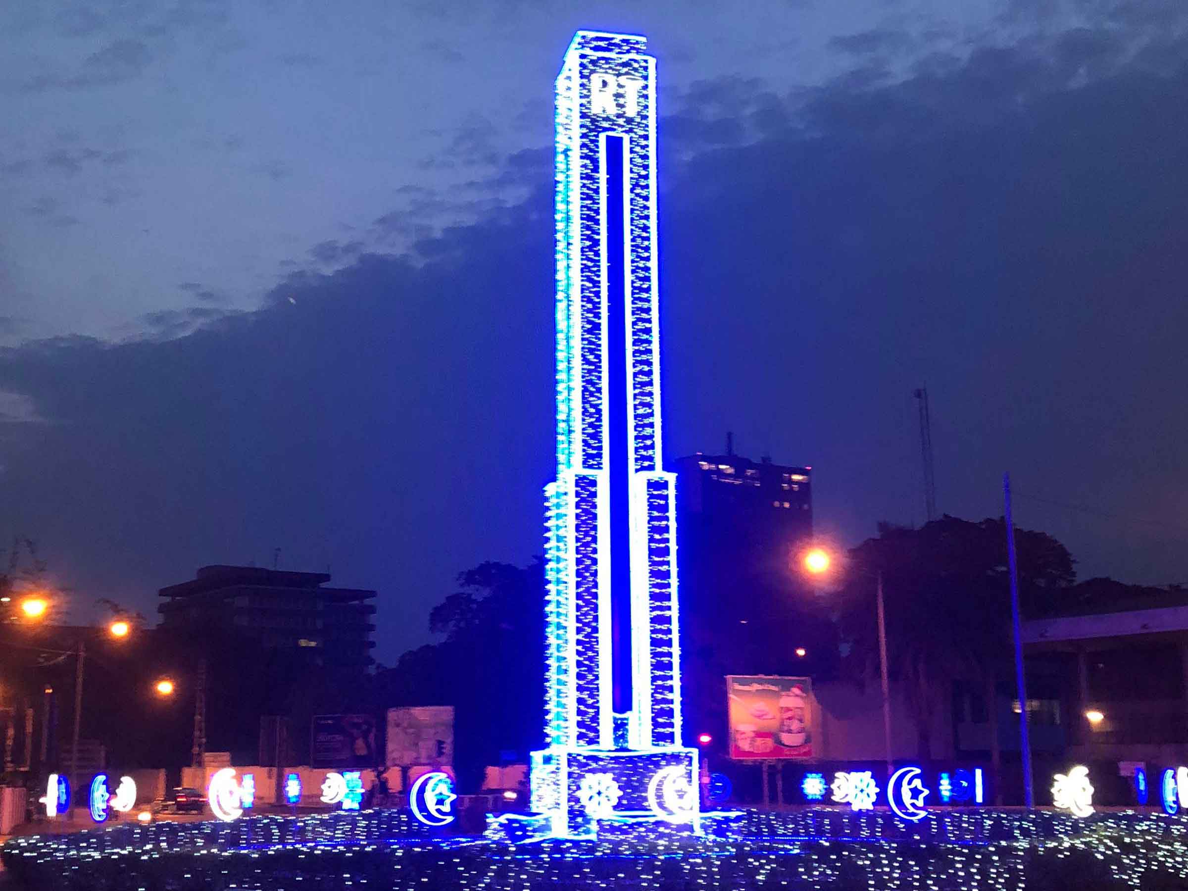 RT Building in Accra Ghana a tall tower with bright blue and white lights