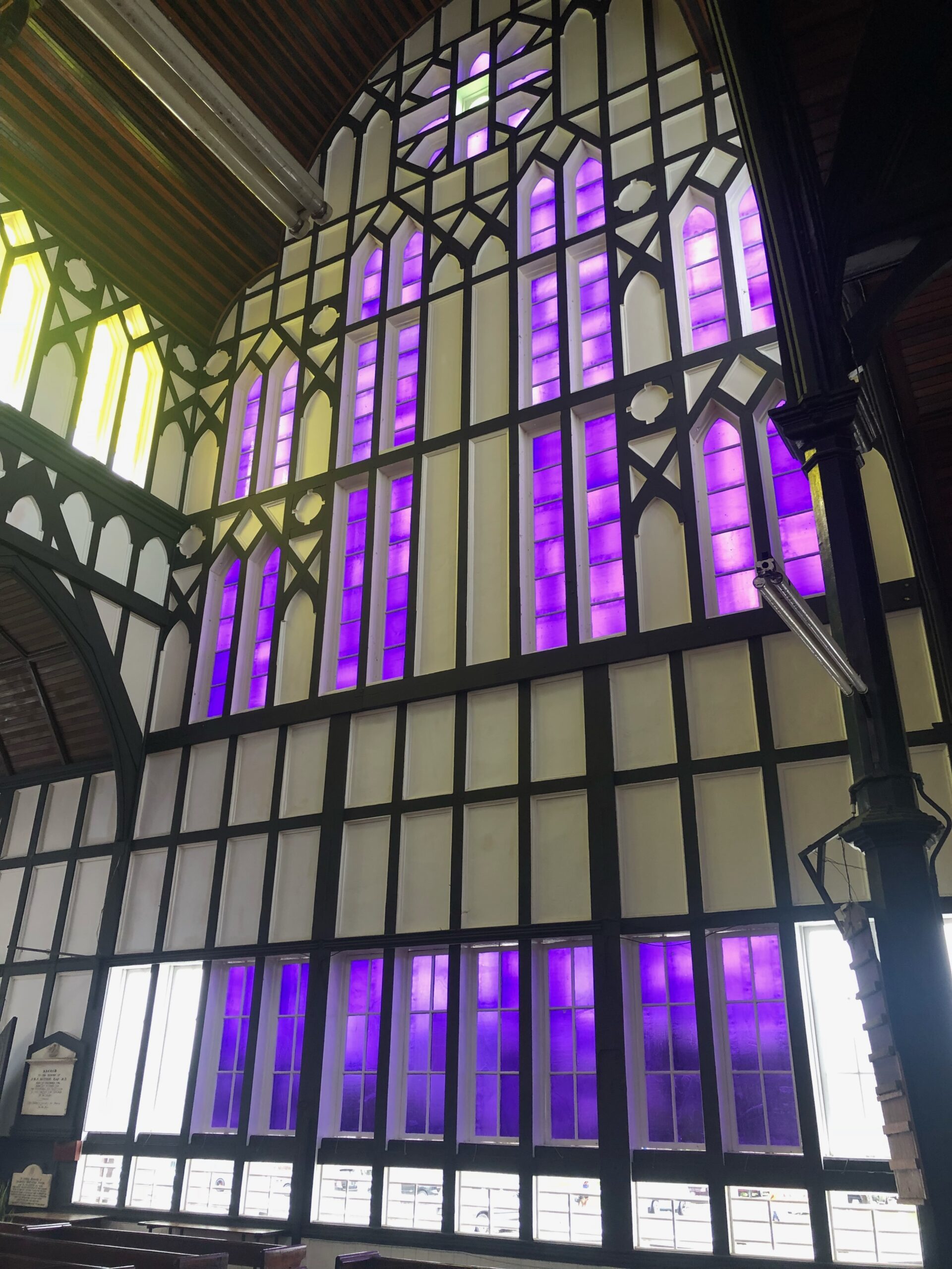 The purple and yellow windows of St. George’s Cathedral